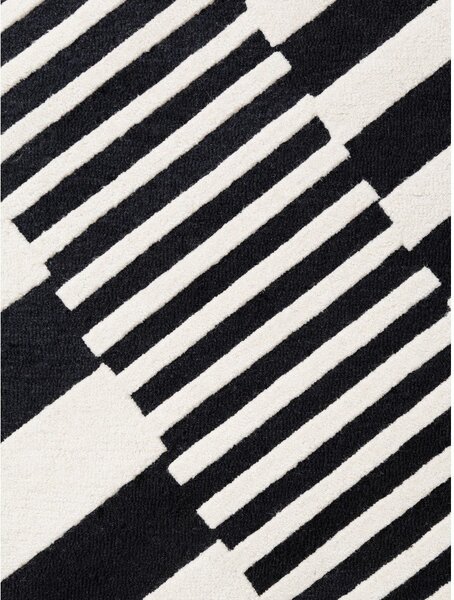 Черно-бял ръчно изработен вълнен килим 120x180 cm Stryve Flux – Elle Decoration