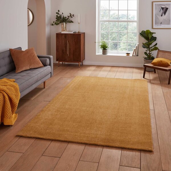 Килим подходящ за пране в цвят жълта охра 60x115 cm Cove – Think Rugs