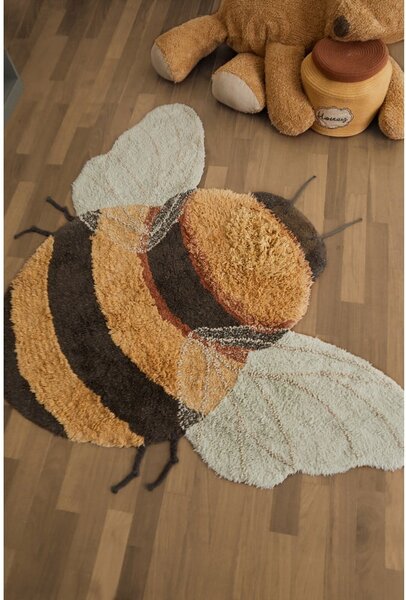 Жълт ръчно изработен памучен детски килим подходящ за пране 115x150 cm Bee – Lorena Canals